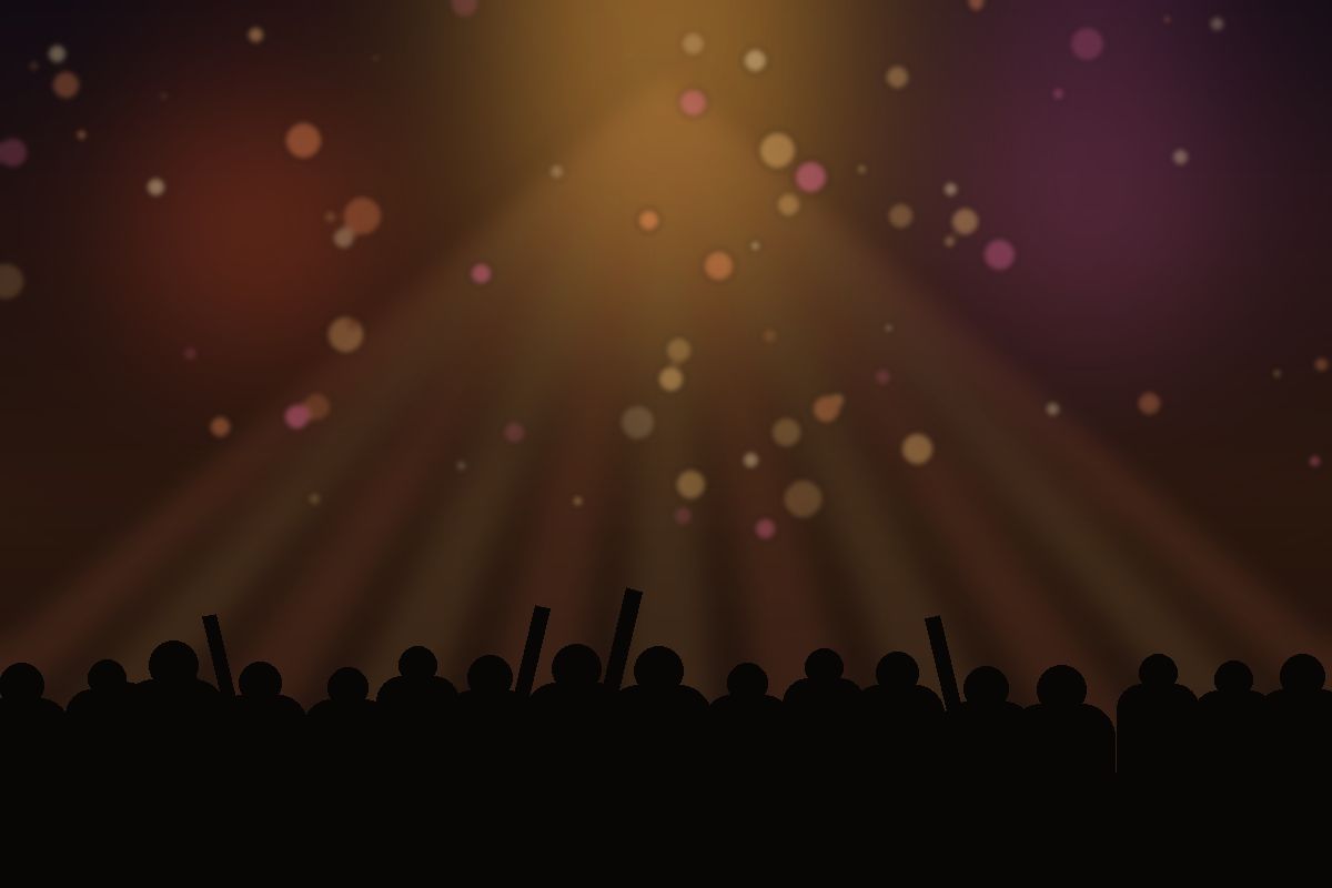 Placeholder image: a crowd under stage lights at a night event